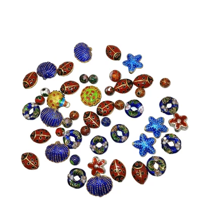 Lote de 49 Cuentas Cloisonne y Esmaltadas Surtidas Mezcladas Ladybugs Estrellas de Mar y Redondas Foto 1 de 4
