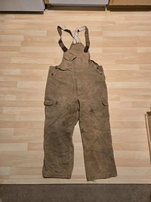 C.C. Mono con tirantes de caza Filson para hombre 38 marrón cera al aceite estilo 27 EE. UU.  Foto 1 de 4