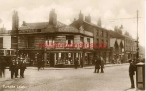 REAL PHOTOGRAPHIC POSTCARD OF THE TURNPIKE, LEIGH, (NEAR WIGAN), LANCASHIRE - Picture 1 of 2