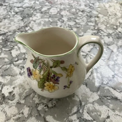 Royal Doulton Milk Jug April.  4 Inches  high Approx. Violets and Primroses   - Image 1 of 4