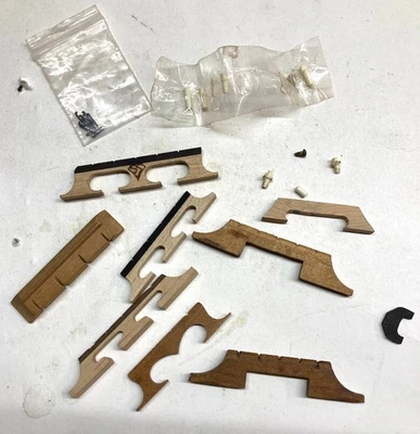 vintage banjo &uke parts lot Snuffy Smith bridge , 8 bone pips, uke bridge ,etc - Image 1 of 4