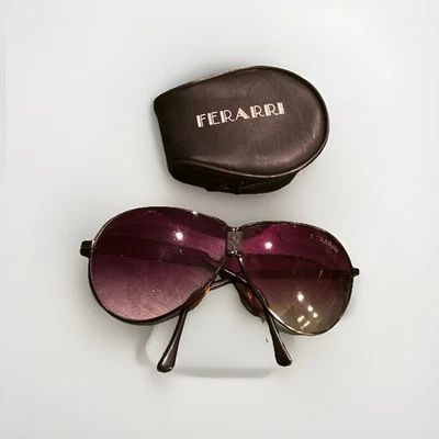 Gafas de sol plegables Ferrari Aviator negras púrpuras vintage años 80 con estuche de transporte Foto 1 de 4