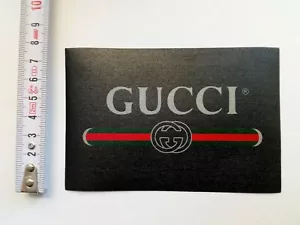 GUCCI THERMOKLEBER PATCH MOD. KLASSISCHES LOGO DOPPEL G HINTERGRUND SCHWARZ 12 X 8 CM - Bild 1 von 1