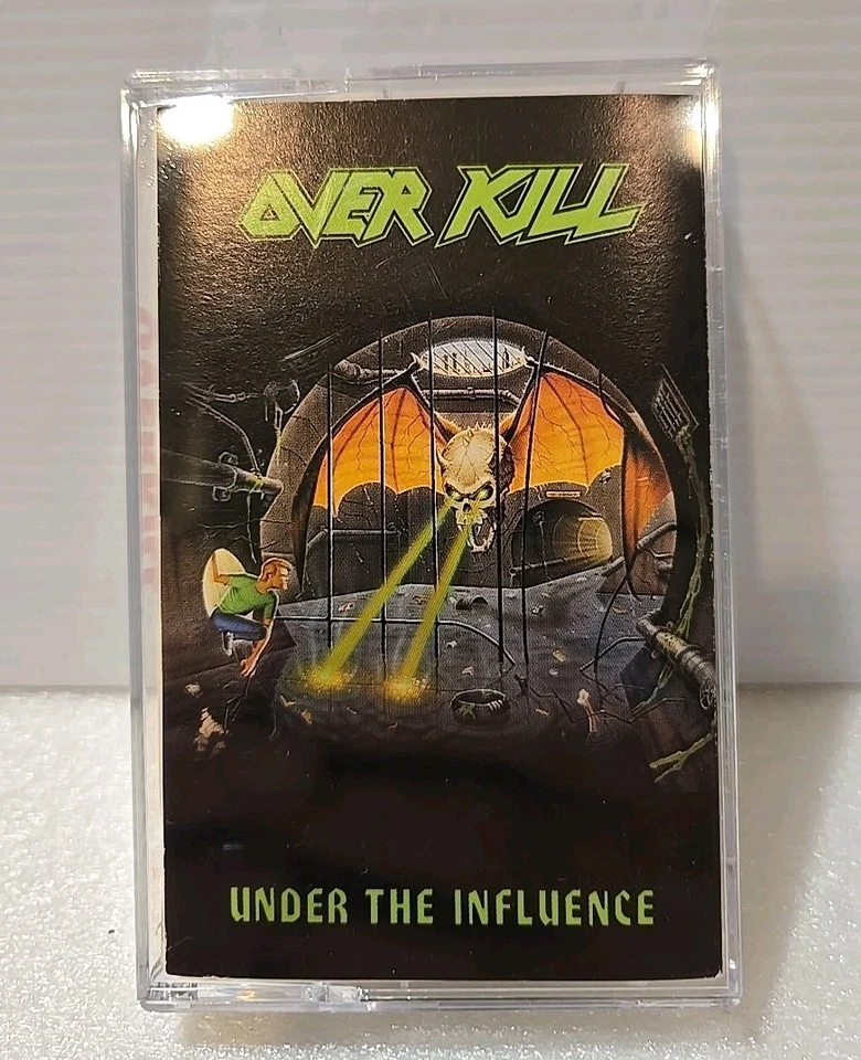 OVERKILL - UNDER THE INFLUENCE - CASSETTE TAPE - TESTED - MEGA FORCE - EXCELLENT - Image 1 of 4