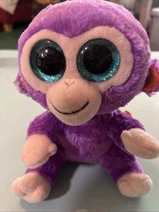 Ty Beanie Boo Uvas el Mono Púrpura Brillo Ojos Grandes Peluche Animal Retirado - Imagen 1 de 5
