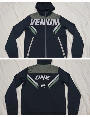 Маленькая мужская ударная куртка с капюшоном на молнии Venum ONE FC MMA черная и зеленая - Изображение 1 из 4