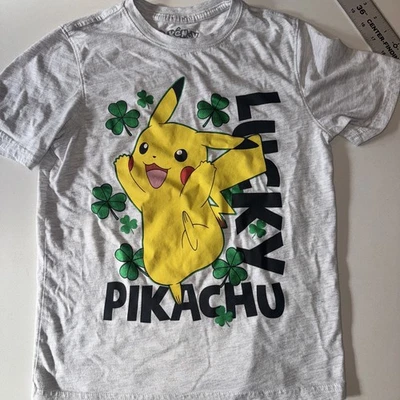 Pokémon Pikachu Lucky Youth Boys Large. T Shirt. Grey With Clovers - Image 1 of 2