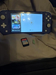 Nintendo Switch Lite. Comes With game, Case, SD Card & Charger - Picture 1 of 3