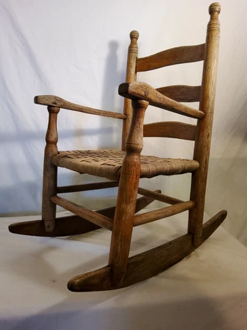 Childs rocking chair, wooden, ladder back, woven seat, 23 1/2"Tx 21"Dx 13 1/2 W Cover