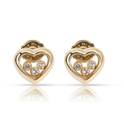 Aretes con corazón de diamantes felices flotantes Chopard en oro amarillo de 18 quilates Foto 1 de 4