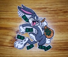 7x6.25 Chenille Bunny running with a bag of money Iron-On Patch is a beauty