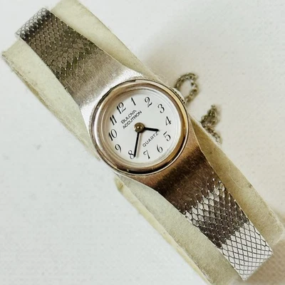 Reloj de vestir Bulova Accutron 1979 vintage cara pequeña para mujer banda de serpiente plateada Foto 1 de 4