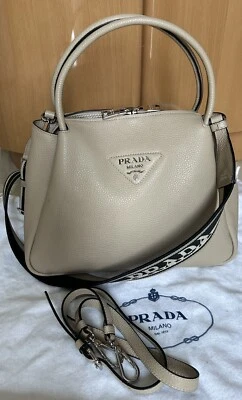 Prada Vitello Daino - Bolso de hombro/tote con cremallera superior, mediano, beige arena/usado Foto 1 de 4