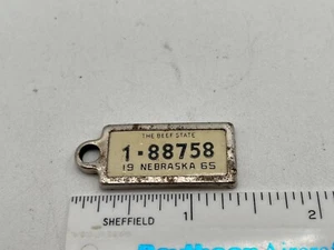 Vintage 1965 Nebraska Disabled American Veterans DAV License Plate Keychain Tag - Picture 1 of 3