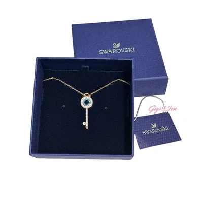 Colgante simbólico Swarovski Mal de ojo y llave, azul, chapado en oro rosa Foto 1 de 4