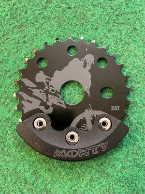 PIÑÓN MONTY 28T CON PROTECTOR CADENA BASHGUARD Foto 1 de 4