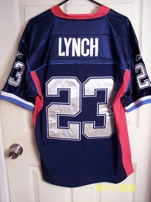 CAMISETA REEBOK MARSHAWN LYNCH COSIDA EQUIPO NFL NUEVA CON ETIQUETAS TALLA 48 BILLETES Foto 1 de 4