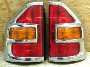 JDM MITSUBISHI PAJERO V75 2006 conjunto de luces traseras de moldeo plateado excedente fabricante de equipos originales - Imagen 1 de 11