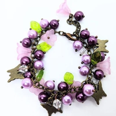 Pulsera caprichosa con dije floral púrpura - De colección - Inspirada con hojas, pájaros Foto 1 de 4