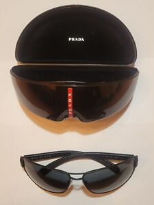Prada Sport Sunglasses Men PS54IS black with red stripes and grey lens.