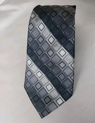 Corbata Calvin Klein 100 % seda gris y negro a cuadros rayas. Pieza atemporal.  Foto 1 de 4