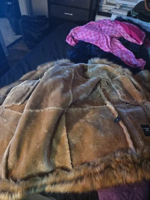 Abrigo de piel de oveja de piel de oveja para mujer Foto 1 de 4