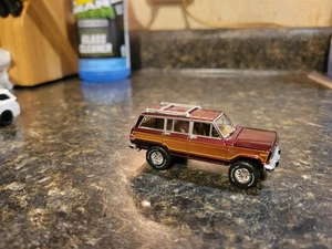 Johnny Lightning 1981 Jeep Wagoneer Classic Gold Burgundy Tire and Wheel Swapped - Picture 1 of 3