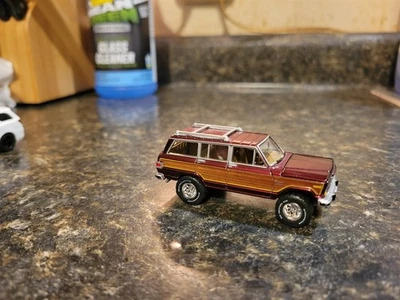 Johnny Lightning 1981 Jeep Wagoneer Classic Gold Burgundy Tire and Wheel Swapped - Image 1 of 3