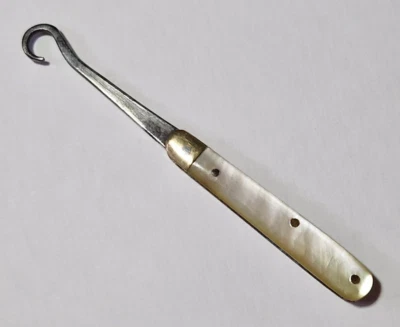 ANTIQUE FOLDING GLOVE BUTTON HOOK - MOTHER OF PEARL HANDLE 1.75" - Image 1 of 4