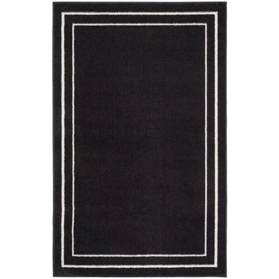 Nourison Essentials Negro Marfil 2 Pies X 4 Pies Alfombra contemporánea sólida Foto 1 de 4