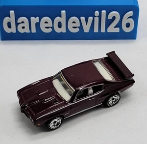 Pontiac GTO 1996 Matchbox Collectibles 1970 granate pilotos reales sueltos 1/67 - Imagen 1 de 9