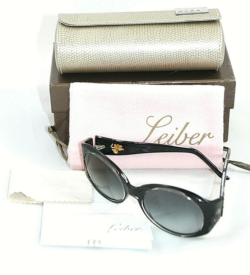 Gafas de sol Judith Leiber para mujer marco negro orquídeas JL1021 estuche Italia Foto 1 de 4