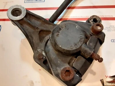 1981 suzuki gs550 L rear brake caliper with mounting bracket and hardware oem - Image 1 of 4