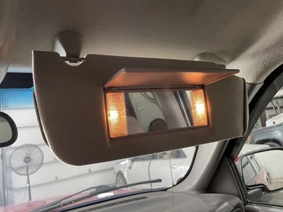 2005 Chevrolet Suburban Passenger Sun Visor Gray Cloth Illuminated Used - Image 1 of 4