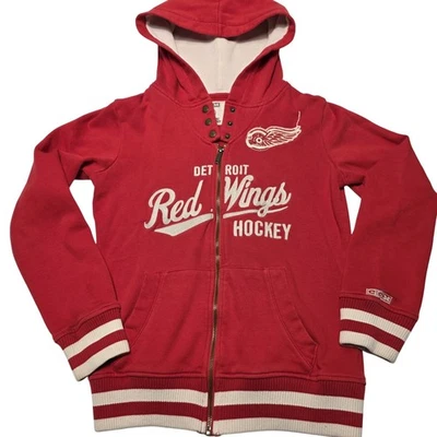 CCM Detroit Red Wings NHL Sudadera con Capucha Cremallera Completa Roja Para Mujer Talla Pequeña” Foto 1 de 4