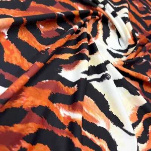 Tela de spandex de tigre con estampado animal elástica de 4 vías 60" de ancho por yarda para trajes de baño - Imagen 1 de 5