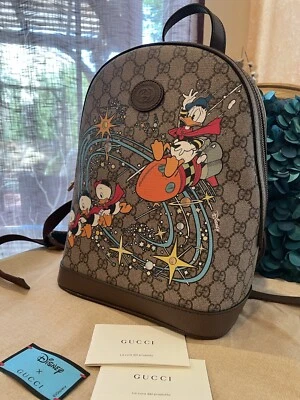 Elegante!* Mochila pequena Disney x Gucci Pato Donald, bolsa GG Supreme nova com etiquetas - Imagem 1 de 4