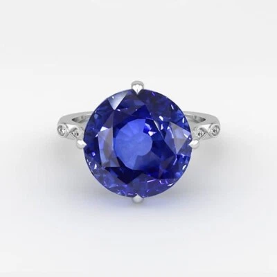 Anillo solitario de compromiso redondo de zafiro simulado de 4,00 quilates chapado en oro blanco de 14 k Foto 1 de 4