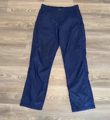 Pantalón cortavientos Tail Tech azul marino rendimiento para mujer talla mediana cremallera frontal Foto 1 de 4