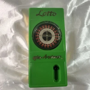 Lotto Spin A Winner 1984 gioco tenuto a mano Megabucks oggetto promozionale lotteria  - Foto 1 di 3