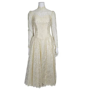 Robe de mariée vintage années 70 ivoire dentelle col haut manches longues - Photo 1/17