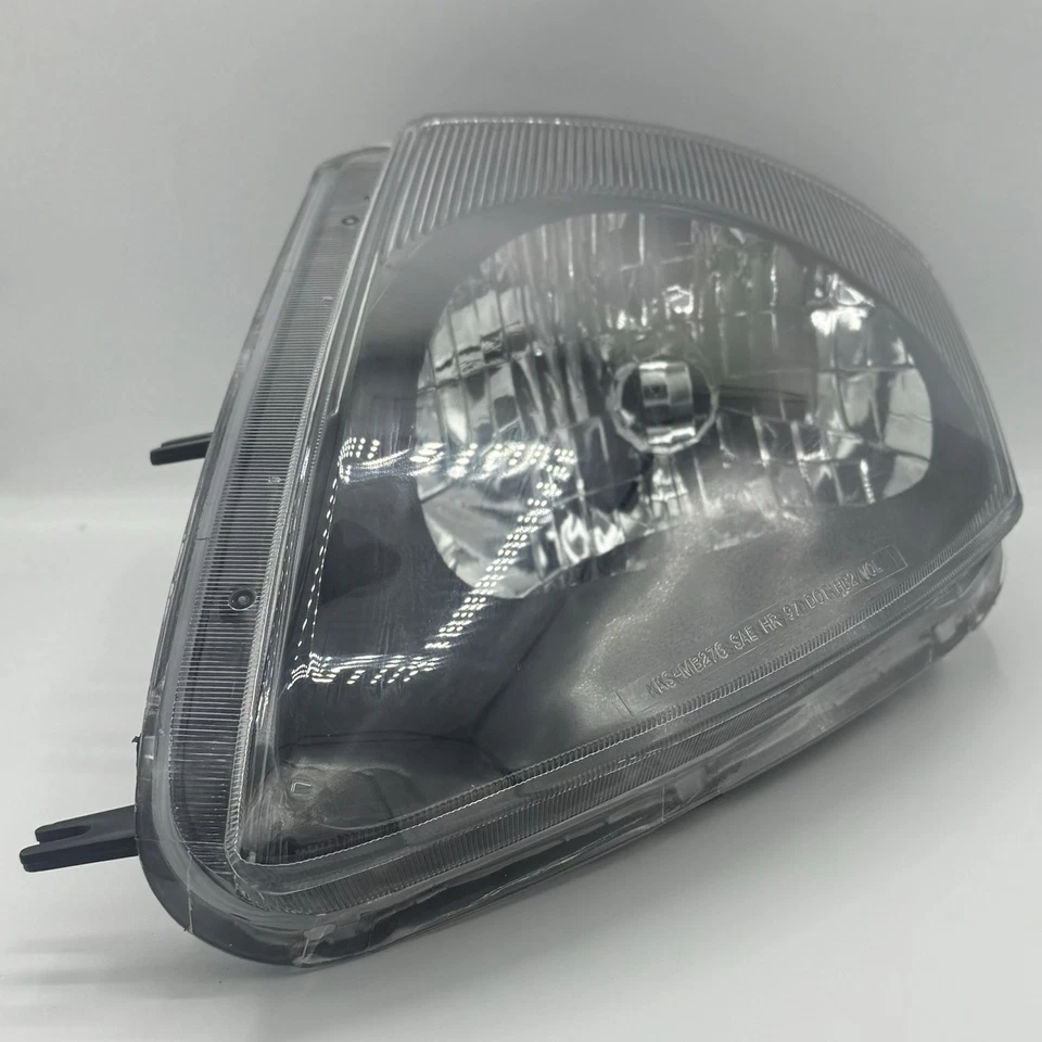 Дымчатая фара со стороны водителя 05 Mitsubishi Eclipse Eagle Eye MB276-B101L - Изображение 1 из 4