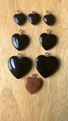 Lot Of 8 New Natural Onyx and Goldstone Heart Pendants In Various Sizes - Image 1 of 4