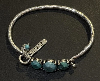 Pulsera con bisagras de piedra color turquesa y tono plata marca Lucky Foto 1 de 4
