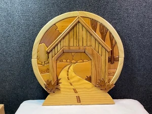 Hand crafted solid wood intarsia wall hanging featuring covered bridge - Picture 1 of 8