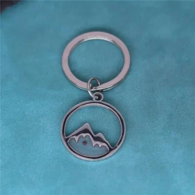 Llavero colgante para hombre de acero inoxidable ahuecado mover montañas llaveros Foto 1 de 3