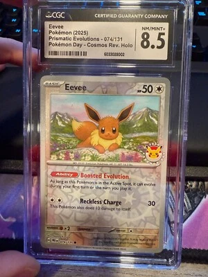 Eevee Pokemon Day Reverse Cosmos 074/131 Prismatic Evolutions CGC 8.5 NM/Mint+ - Image 1 of 2