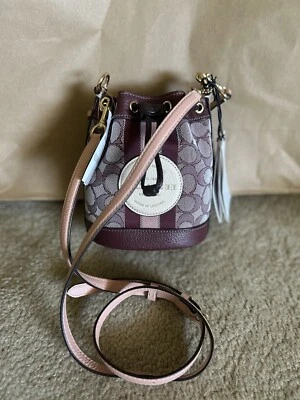 COACH MINI DEMPSEY BUCKET BAG IN SIGNATURE JACQUARD WITH STRIPE & COACH PATCH  - Image 1 of 4