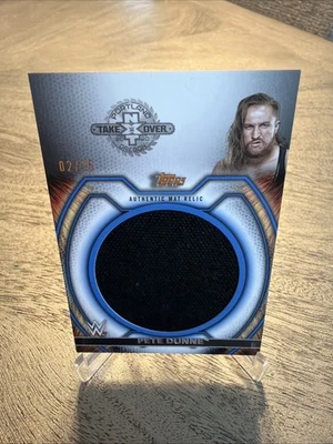 2021 Topps WWE Undisputed - Superstar Mat Relics Pete Dunne #M-PD Blue /25 (MEM) - Image 1 of 3