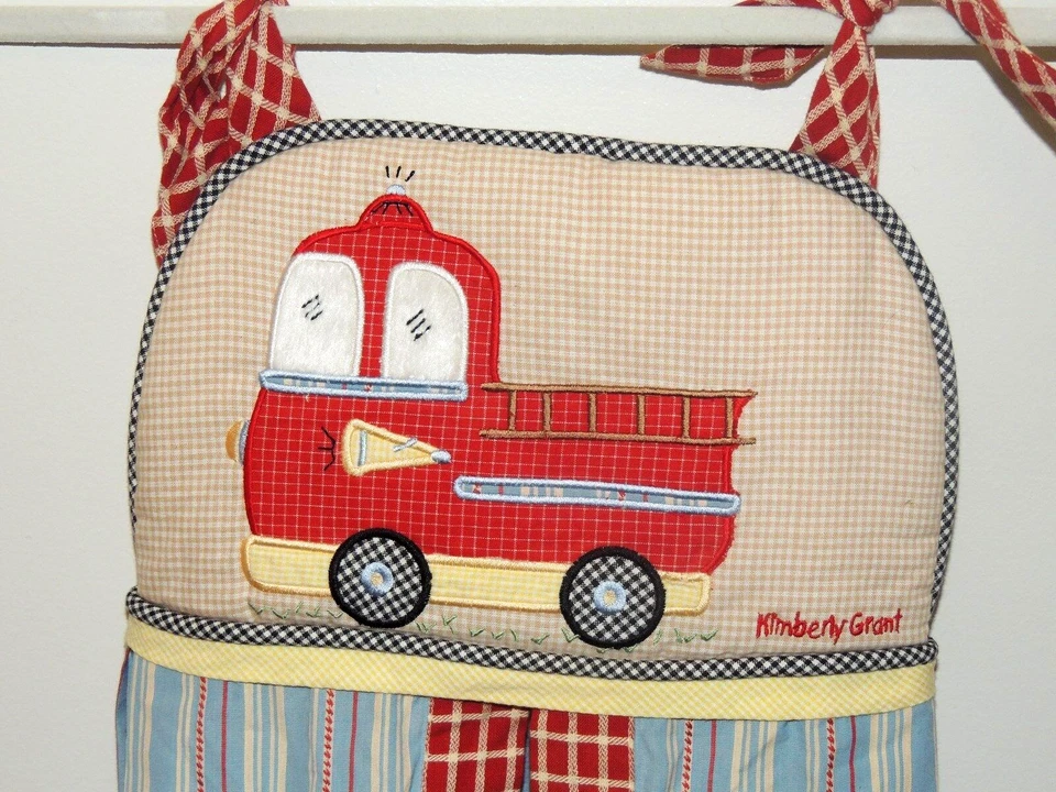 EMPILHADOR DE FRALDAS CAMINHÃO DE BOMBEIROS COCALO KIMBERLY GRANT VERMELHO AZUL AMARELO - Imagem 1 de 2